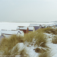 Buy canvas prints of Sand dunes and beach huts covered in snow. by Liam Grant