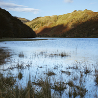 Buy canvas prints of Brothers Water with Angletarn Pikes beyond by Liam Grant