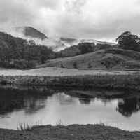 Buy canvas prints of Dramatic sky and reflections on the River Brathay  by Liam Grant