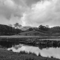 Buy canvas prints of Dramatic sky and reflections on the River Brathay  by Liam Grant