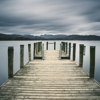 Buy canvas prints of Jetty on Lake Windermere with Langdale Pikes beyon by Liam Grant