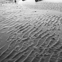Buy canvas prints of Metal embedded in the sand at low tide. by Liam Grant