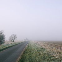 Buy canvas prints of Morning frost and fog over rural country road. by Liam Grant