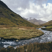 Buy canvas prints of Gatesgarth Beck flowing through the Honister Pass. by Liam Grant