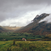 Buy canvas prints of Langdale Valley and Langdale Pikes in cloud. by Liam Grant