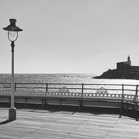 Buy canvas prints of Lighthouse from Mumbles Pier. Wales, UK. by Liam Grant
