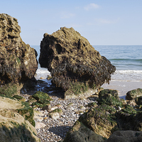 Buy canvas prints of Coastal rock formations at low tide. Tenby, Wales, by Liam Grant