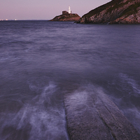 Buy canvas prints of Lighthouse at dusk. Mumbles, Wales, UK. by Liam Grant