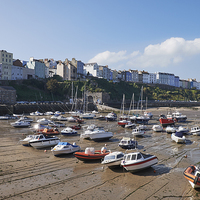 Buy canvas prints of Boats in Tenby Harbour at low tide. Wales, UK. by Liam Grant