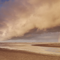 Buy canvas prints of Storm clouds and rainbow at sunset. Holkham, Norfo by Liam Grant