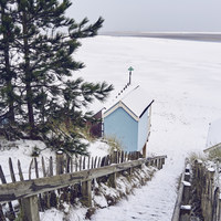 Buy canvas prints of Steps and beach huts covered in snow. Wells-next-t by Liam Grant