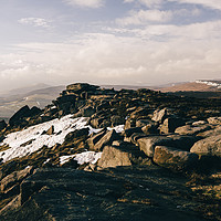 Buy canvas prints of Snow on Stanage Edge at sunset. Derbyshire, UK. by Liam Grant