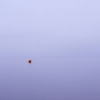 Buy canvas prints of Cloudy sky a bouy reflected in a calm ocean at twi by Liam Grant