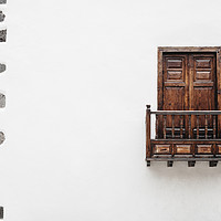 Buy canvas prints of Wooden window door and balcony in a white wall. La by Liam Grant