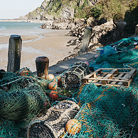Buy canvas prints of Fishing nets and lobster pots in the harbour at Il by Liam Grant