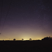 Buy canvas prints of Star filled sky with tree silhouettes on the horiz by Liam Grant
