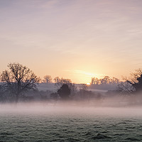 Buy canvas prints of Sunrise and mist on a frosty morning. Norfolk, UK. by Liam Grant