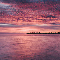 Buy canvas prints of Pink dawn sky reflected in the surface of the sea. by Liam Grant