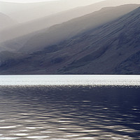 Buy canvas prints of Shafts of sunlight at sunset of Crummock Water. Cu by Liam Grant