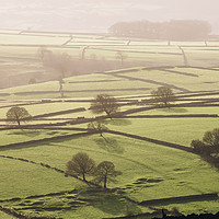 Buy canvas prints of Hazy light at sunset over a valley of fields. Derb by Liam Grant
