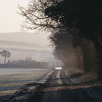 Buy canvas prints of Rays of sunlight and frost along a remote country  by Liam Grant