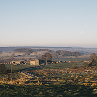 Buy canvas prints of Moon over a farm at sunrise. Derbyshire, UK. by Liam Grant