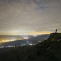 Buy canvas prints of Male and his dog, standing on Curbar Edge at night by Liam Grant