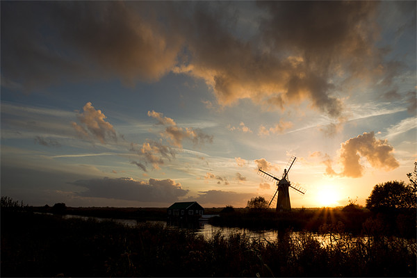 Thurne Windmill at sunset Picture Board by Simon Wrigglesworth