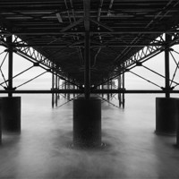 Buy canvas prints of Undertow - Cromer Pier by Simon Wrigglesworth