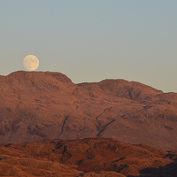 Buy canvas prints of  MOON RISING over Hard Knott  by Paul Leviston