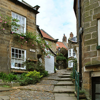 Buy canvas prints of A Cobbled Street in Robin Hoods Bay by graham young