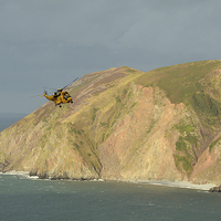 Buy canvas prints of Rescue Helicopter over Lynmouth Bay  by graham young