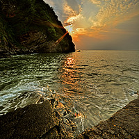 Buy canvas prints of Sunset at Lee Abbey Bay by graham young