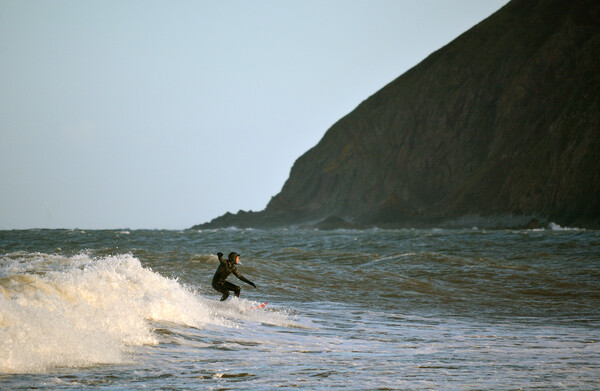 Surfer at  Lynmouth Picture Board by graham young