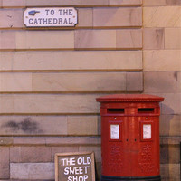 Buy canvas prints of Red Post Box against a stone wall by neal frost