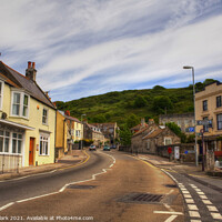 Buy canvas prints of Charming Village with a Painterly Sky by Nicola Clark