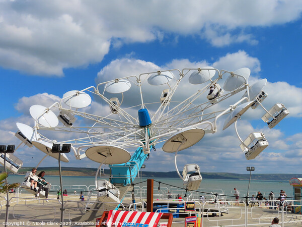 Thrilling Paratrooper Ride on Weymouth Beach Picture Board by Nicola Clark