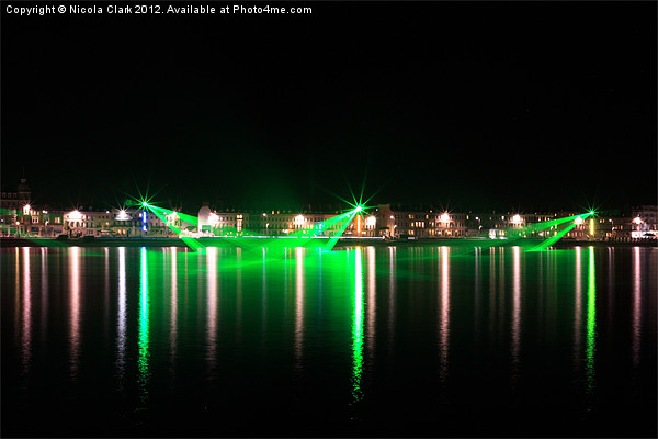 Weymouth Seafront Lasers Picture Board by Nicola Clark