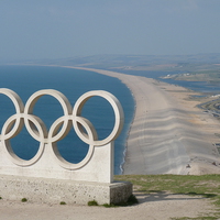 Buy canvas prints of Chesil Beach and Olympic Rings by Nicola Clark