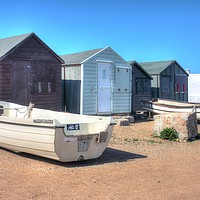Buy canvas prints of Boats and Huts by Nicola Clark