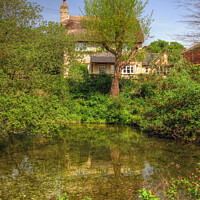 Buy canvas prints of Enchanting Thatched Cottage by Wildlife Pond by Nicola Clark