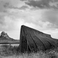 Buy canvas prints of Fishermans Shed and Lindisfarne Castle by Dave Turner