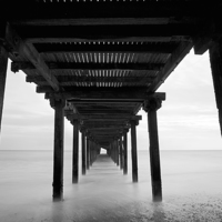 Buy canvas prints of Under the Pier, Lowestoft by Dave Turner