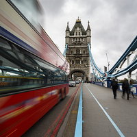 Buy canvas prints of  Bus on Tower Bridge, London by Izzy Standbridge