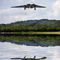 Buy canvas prints of  Vulcan XH558 over water by Tony Bates