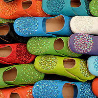 Buy canvas prints of Colorful slip on shoes by Tony Bates