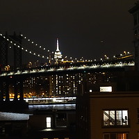 Buy canvas prints of Manhattan Bridge and Empire State Building at nigh by Marja Ozwell