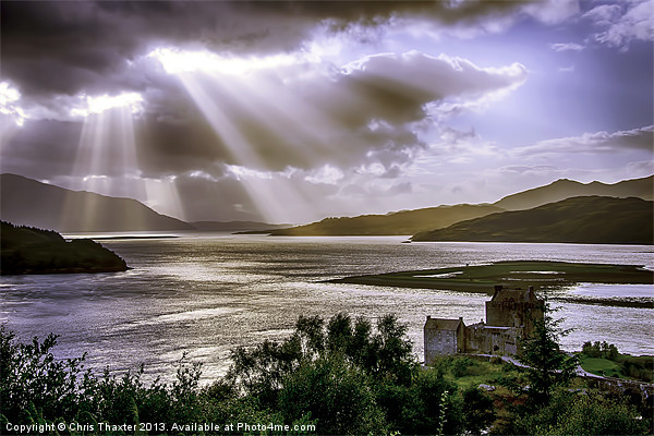 Sun Rays over Eilean Donan Castle Picture Board by Chris Thaxter