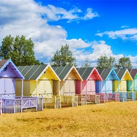 Buy canvas prints of Pastel Beach Huts by Chris Thaxter