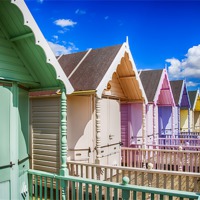 Buy canvas prints of Pastel Beach Huts 3 by Chris Thaxter